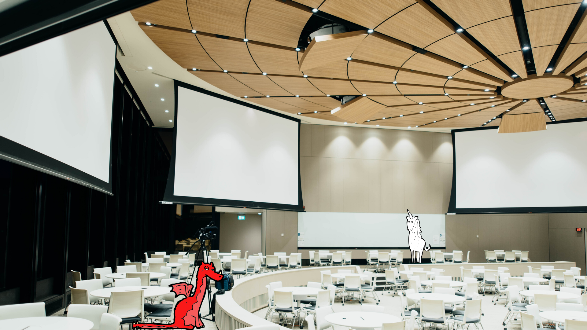 Empty auditorium with red dragon and white unicorn illustration